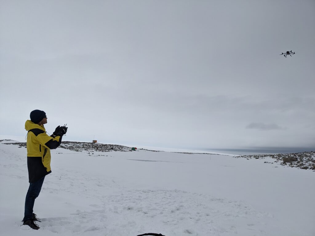 Drone in flight over polar landscape