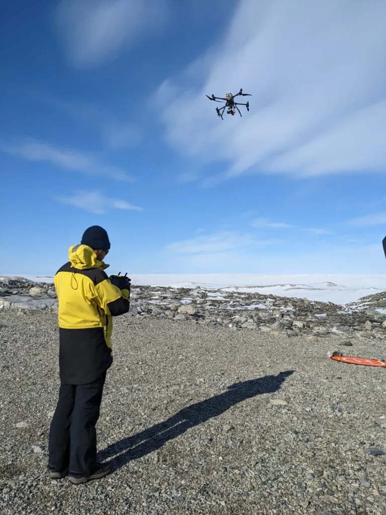 Juan in field gear with drone, Antarctica