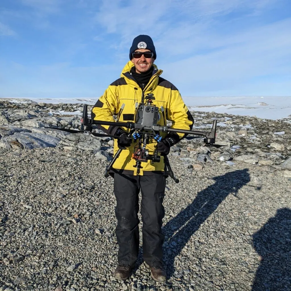 Juan piloting a drone in Antarctica